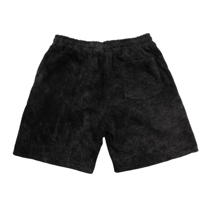 Back view of a acid wash elevated silhouette sweatshorts features refined embroidery and screen-printed details on the front, delivering comfort, structure, and edge in equal measure.