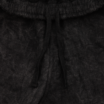 Close up drawstrings view of a acid wash elevated silhouette sweatshorts features refined embroidery and screen-printed details on the front, delivering comfort, structure, and edge in equal measure.