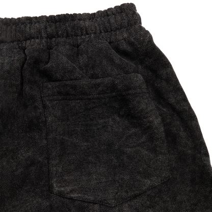 Back pocket view of a acid wash elevated silhouette sweatshorts features refined embroidery and screen-printed details on the front, delivering comfort, structure, and edge in equal measure.