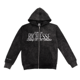 Front view of an acid wash full-zip silhouette features elevated embroidery and screen-printed details on the front, balancing structure, comfort, and edge.
