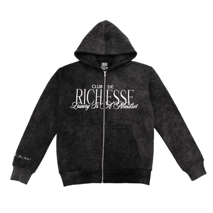 Front view of an acid wash full-zip silhouette features elevated embroidery and screen-printed details on the front, balancing structure, comfort, and edge.
